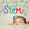 child looking up at colorful lettering of STEM