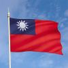 The Taiwanese flag which is a red field with a blue square in the upper-left corner. In the blue square is a white sun. 
