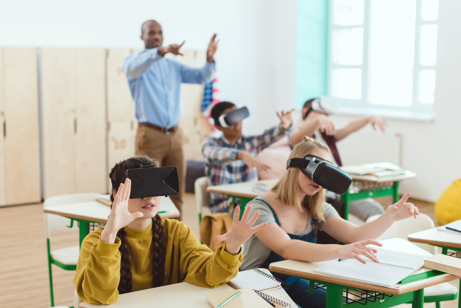 kids in classroom using VR eyeglasses
