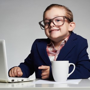 child wearing a suit and glasses