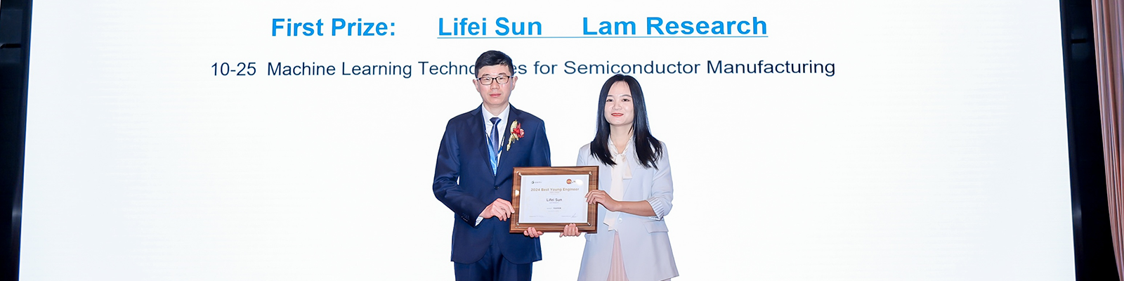 Li Fei Sun holding her first prize award with a CSTIC representative. 