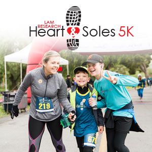 Heart & Soles 5K by Lam Research. A parent and two children at a running race. 