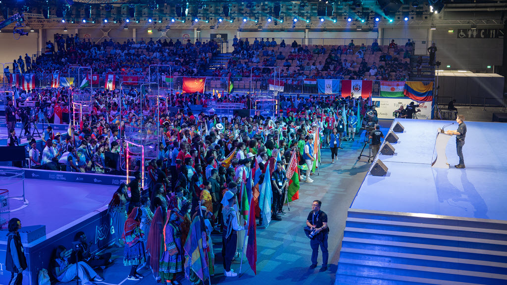 people standing in front of stage at welcome ceremony
